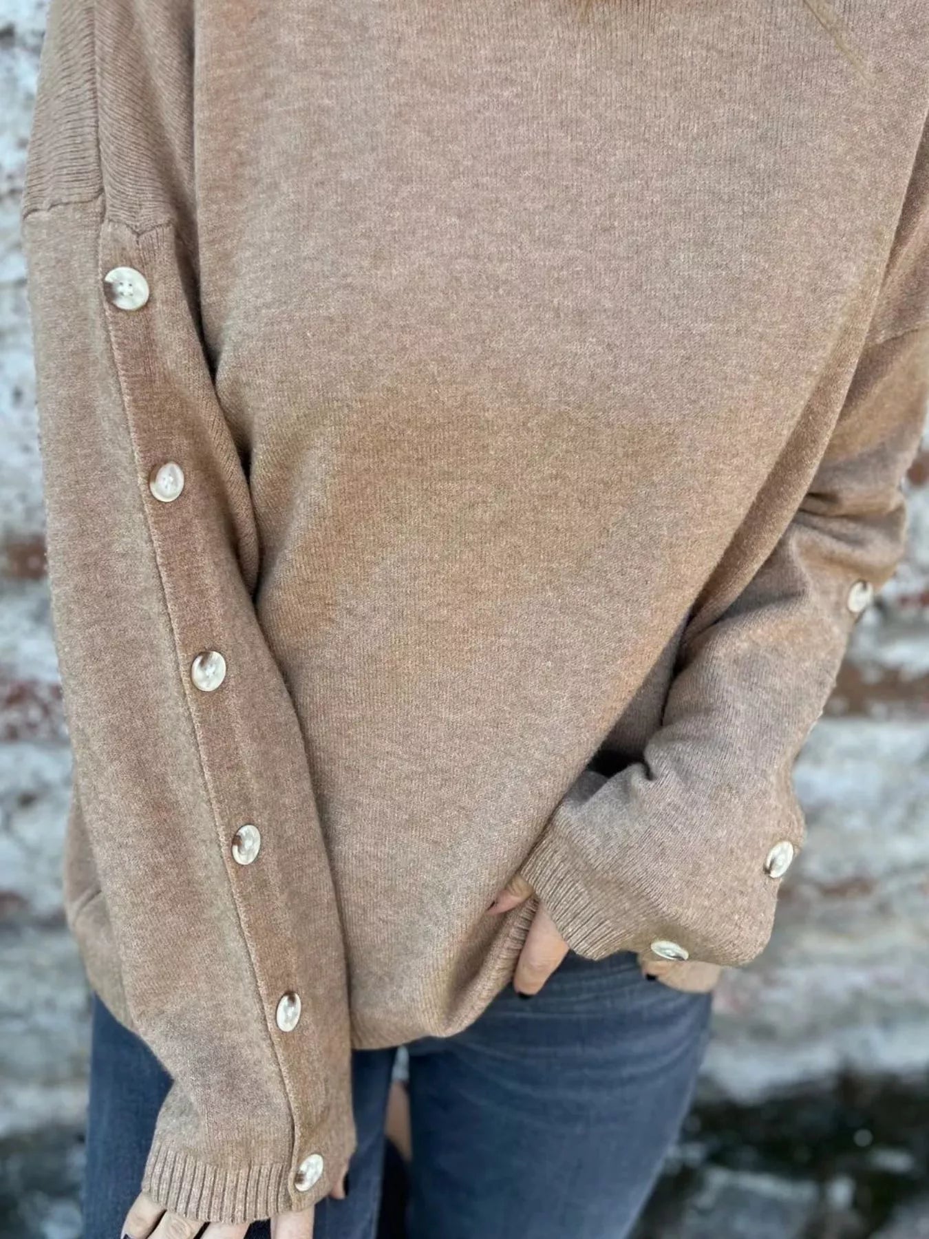 Khaki turtleneck long sleeve sweater with ribbed cuffs and buttoned sleeves
