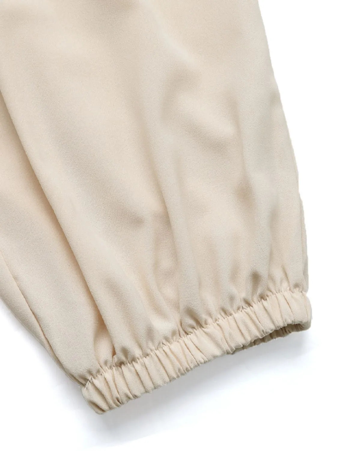 Cream jogger hem with elastic cuff and smooth gathered fabric