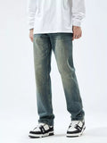 Men's slim-fit washed stretch jeans in vintage blue, front view with belt loops