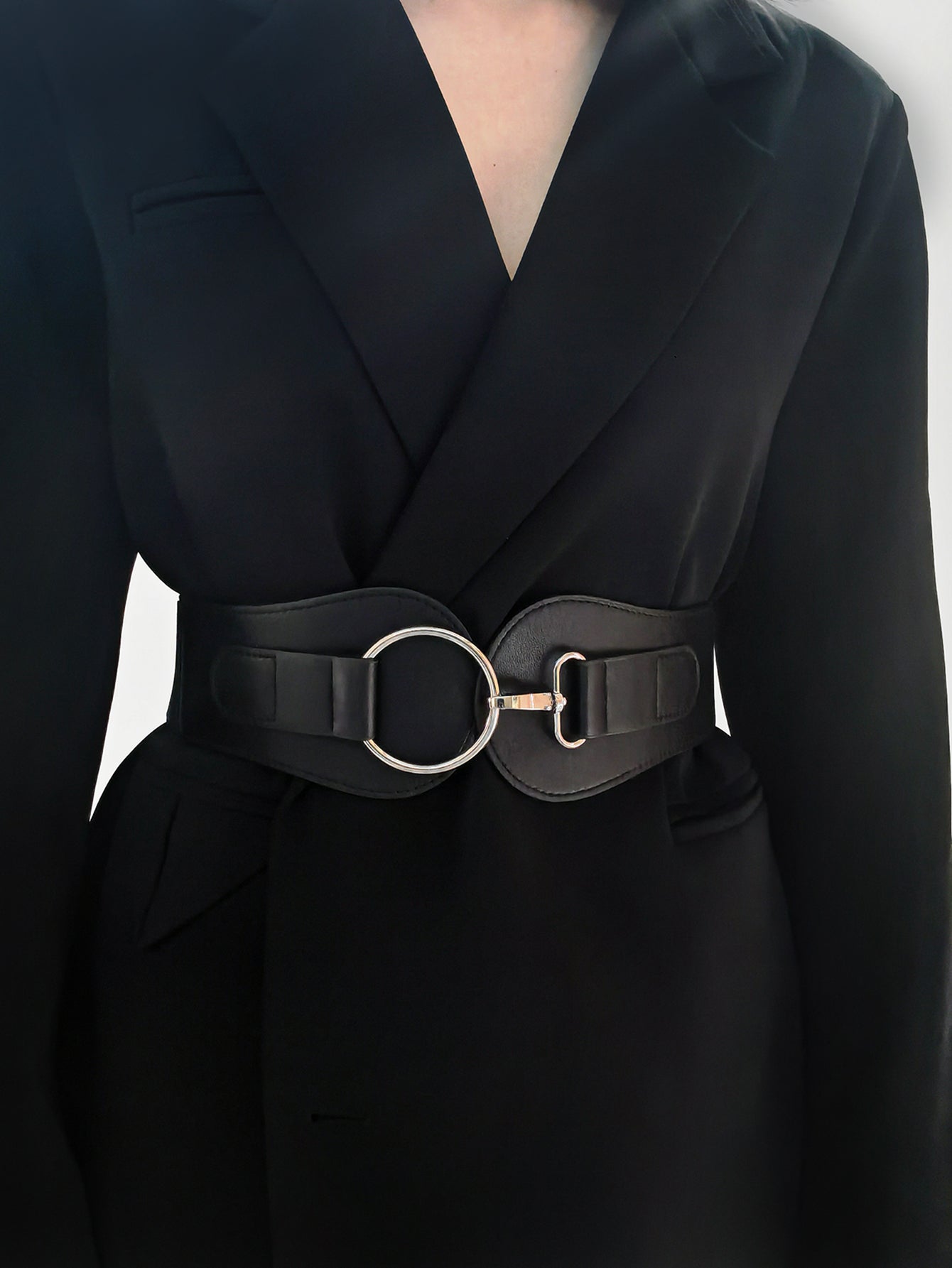 Black vegan leather wide elastic belt with O-ring buckle and metal strap hardware