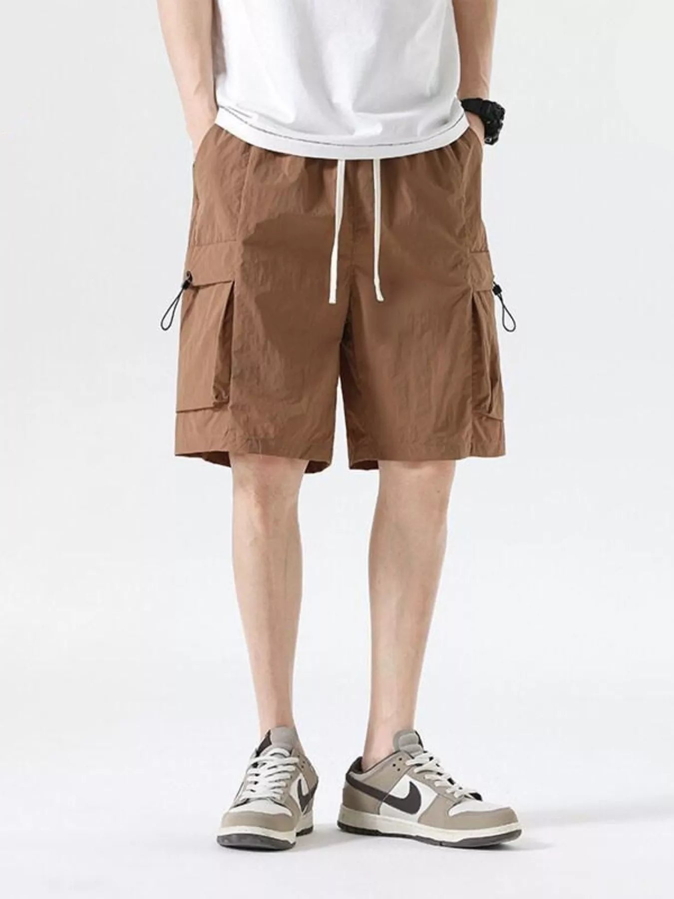 Brown cargo shorts with drawcord waist and flap cargo pockets