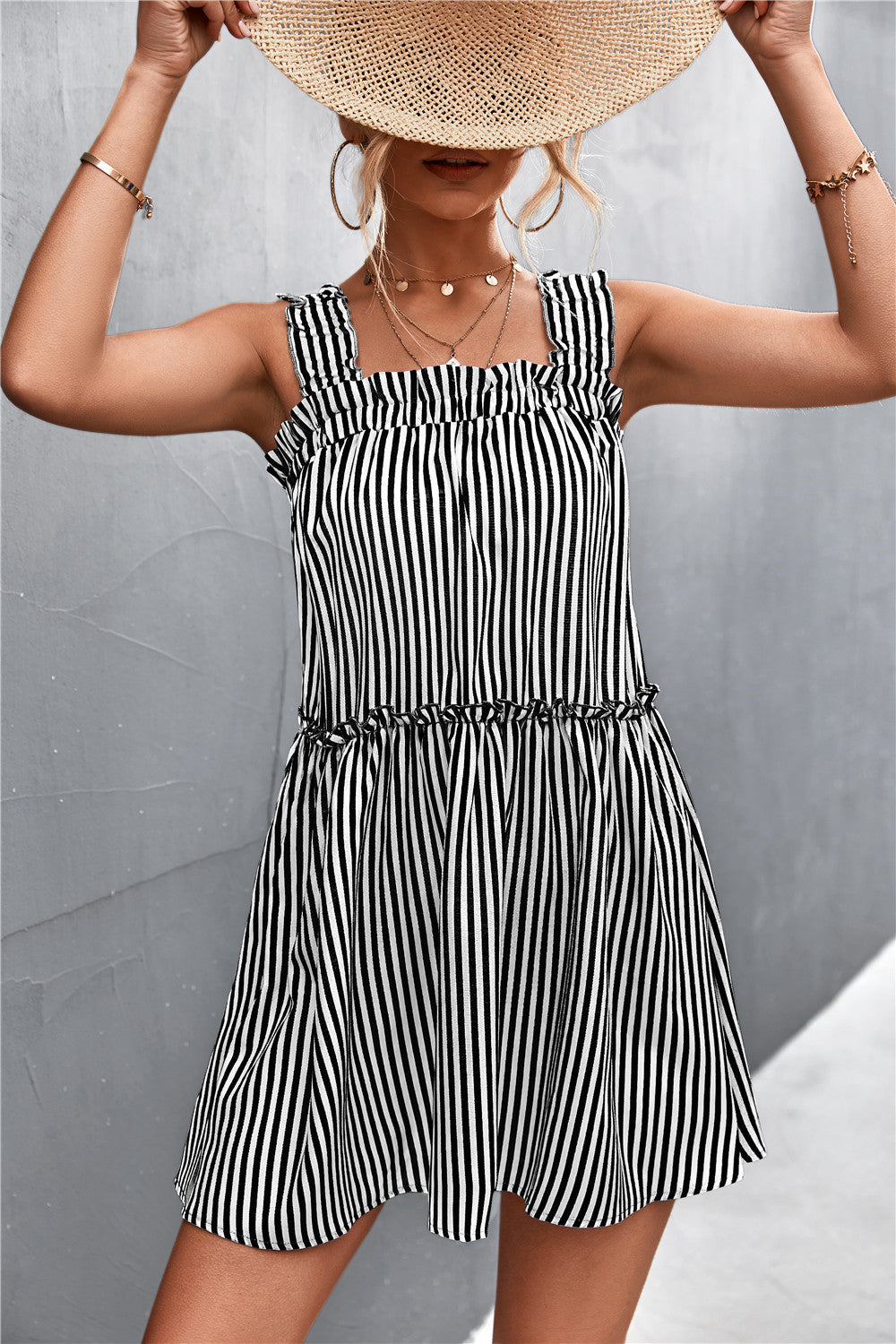 Black and white striped square-neck dress with ruffled straps and tiered skirt