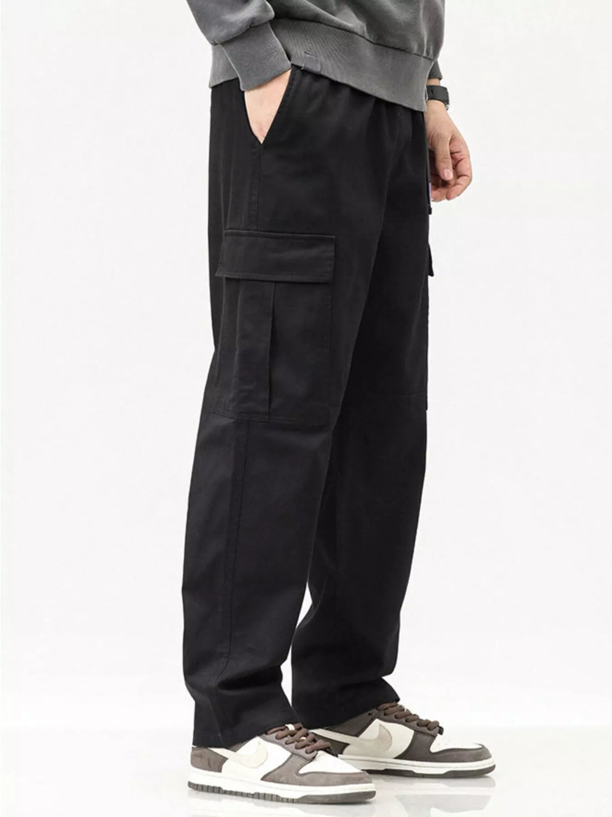 Men's cargo pants in black with elastic waist and large side cargo pockets