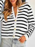 White and black striped button-up cardigan with gold button placket and V neckline