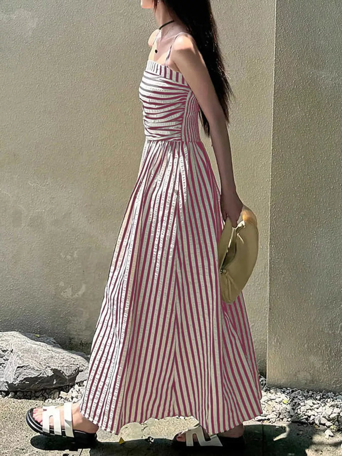 Ruched sleeveless maxi dress with pink-and-white vertical stripes and thin straps