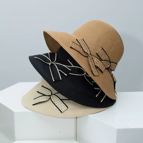 Bowknot straw sun hat with black ribbon applique on beige wide brim