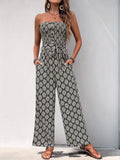 Black and white printed smocked sleeveless jumpsuit with wide-leg, tied waist