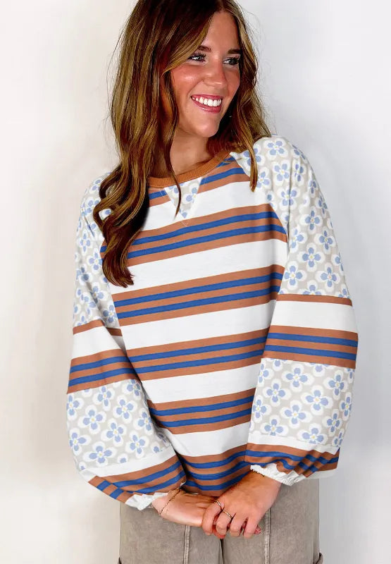 Raglan sweatshirt in white with blue and orange stripes and patterned floral raglan sleeves