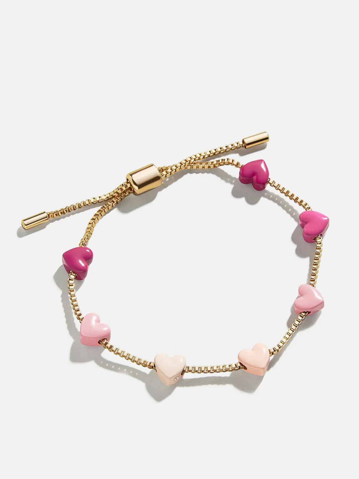 Pink heart charm adjustable bracelet with gold chain and heart bead accents