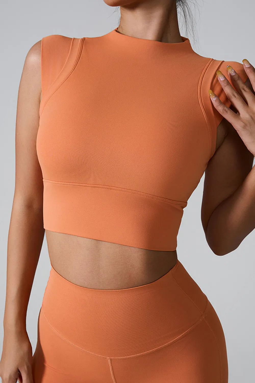 Orange mock neck active tank, sleeveless fitted cropped hem