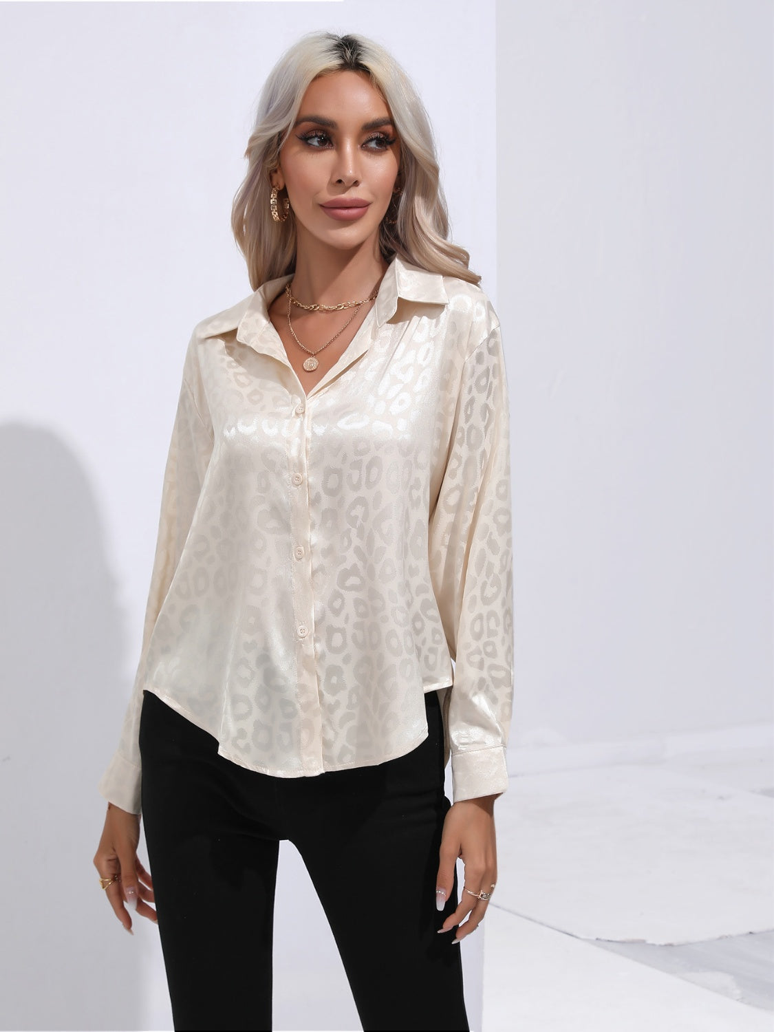 Cream leopard-print collared button-up shirt with button placket, long sleeves