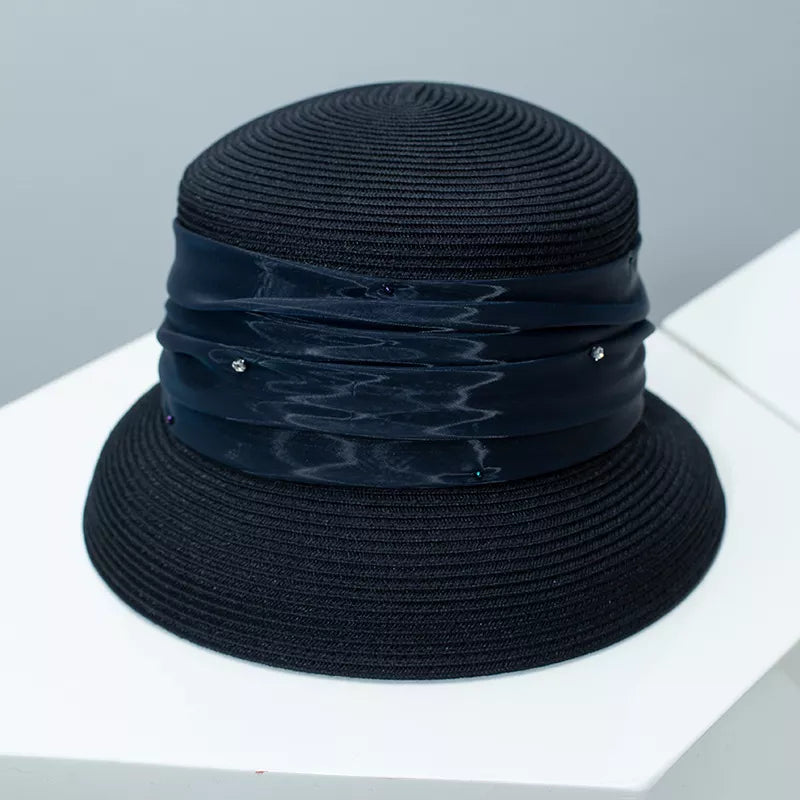 Cedar & Moore Ribbon Detail Hat in black straw with navy ribbon wrap and rhinestones.