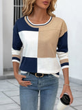 Color block round-neck sweater with ribbed trim in navy, white, and beige panels