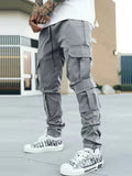 Men's gray drawstring cargo pants with flap pocket on the leg and cuffed ankles