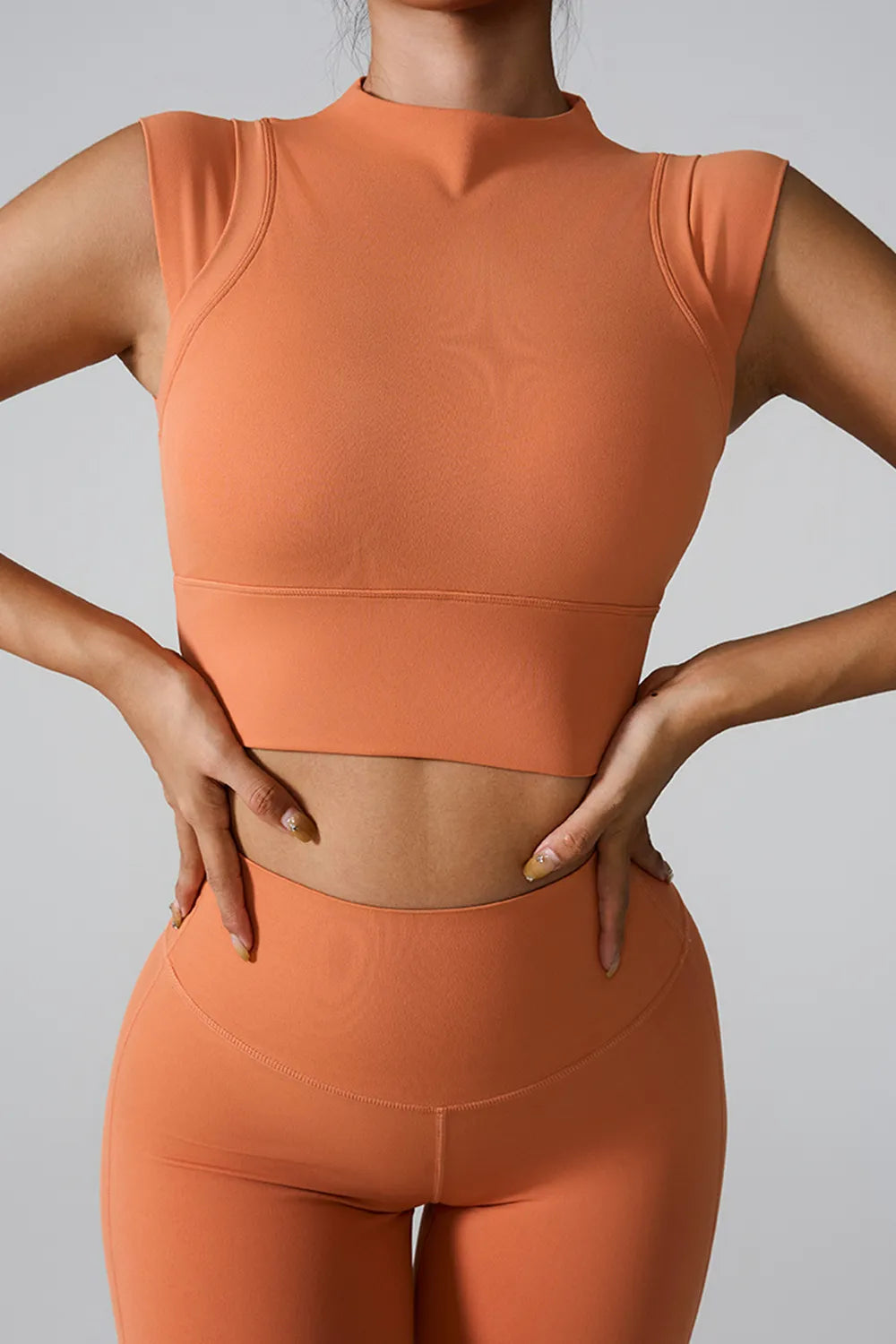 Orange mock neck active tank, sleeveless fitted crop, seamed
