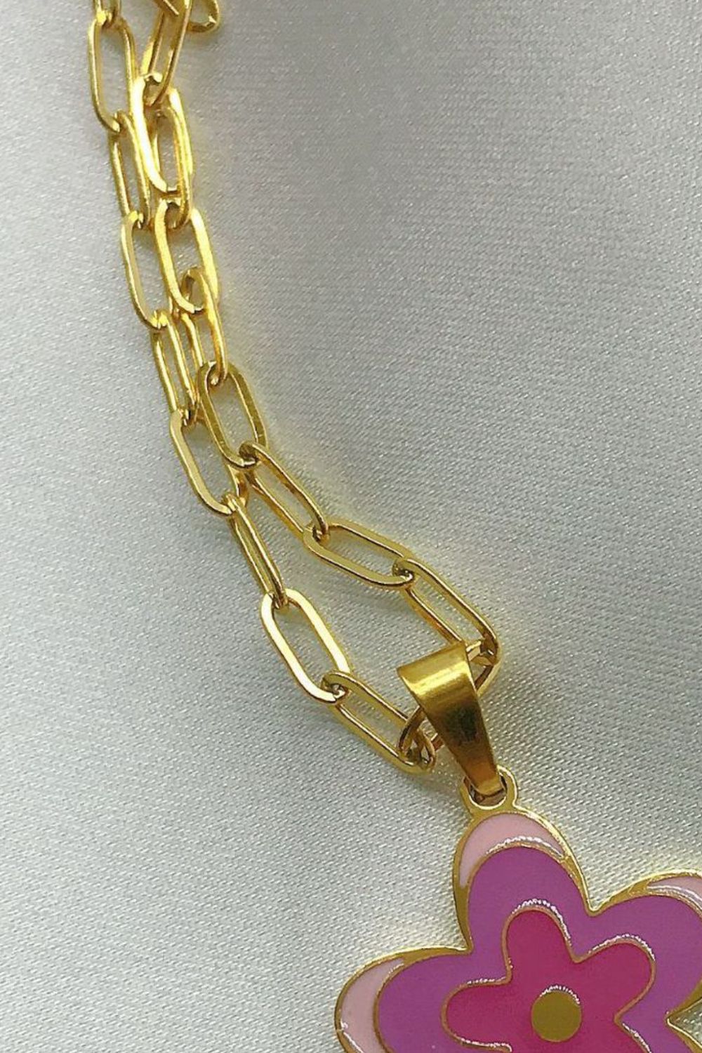 Gold-tone chain link necklace with partial purple flower pendant