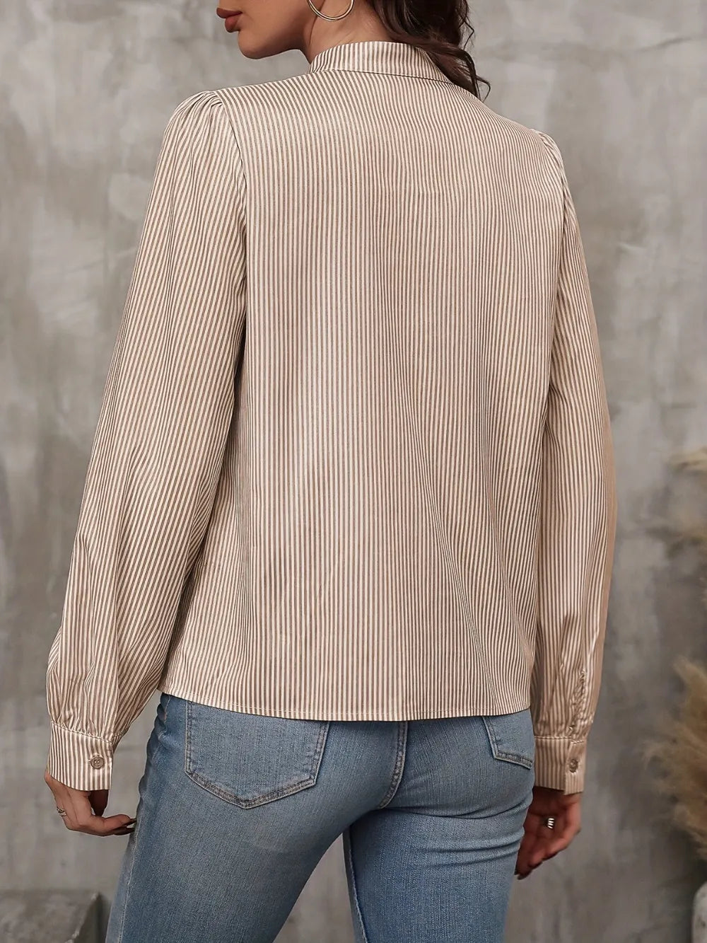 Taupe striped long sleeve blouse, back view with buttoned collar and gathered cuffs