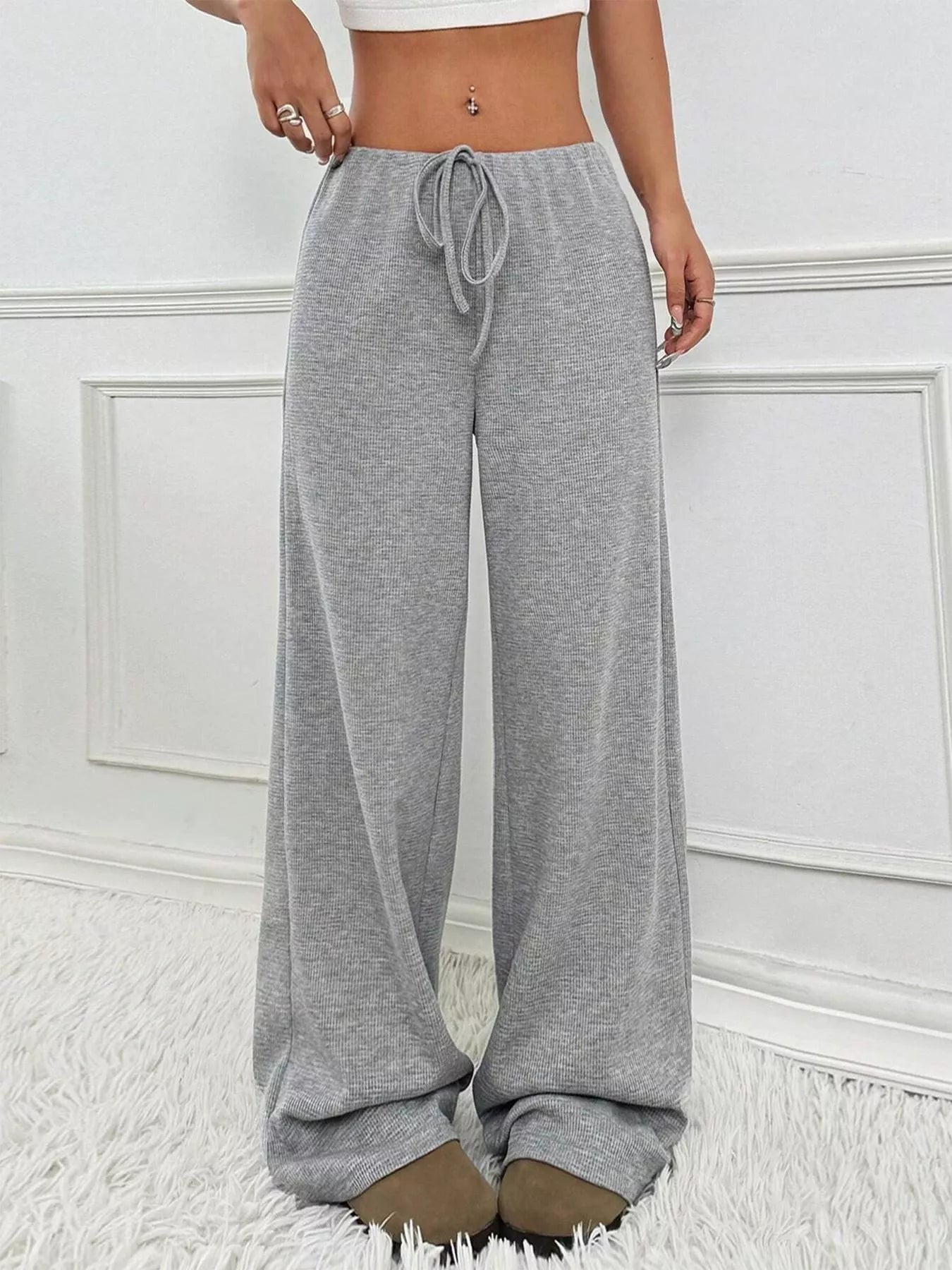 Wide-leg drawstring pants in heather gray ribbed knit, tied elastic waist