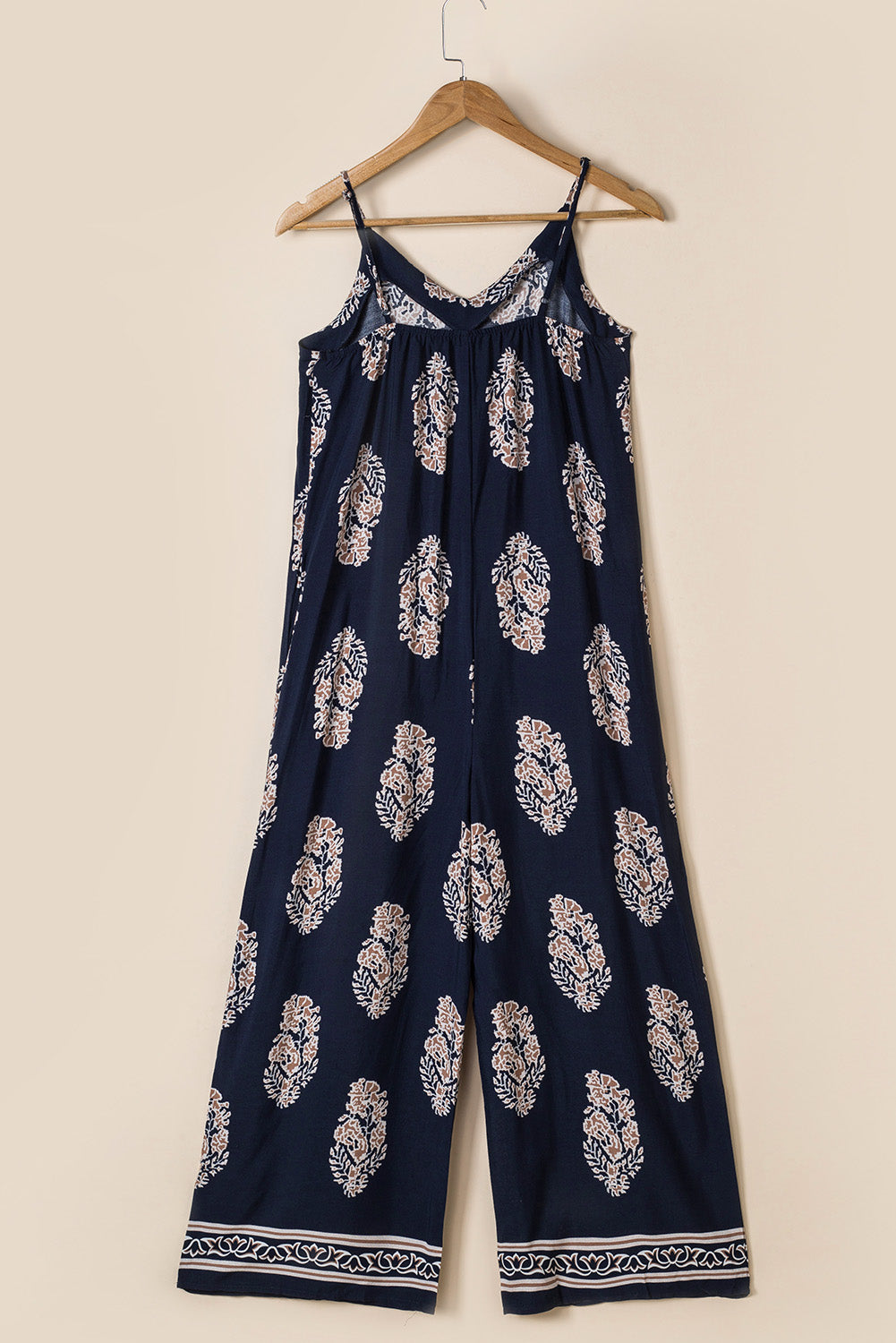 Dark blue printed sleeveless jumpsuit with V-neckline and wide-leg trousers