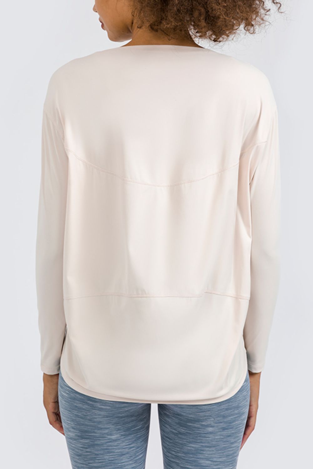 Cream loose fit active top, long sleeves with back seam panel
