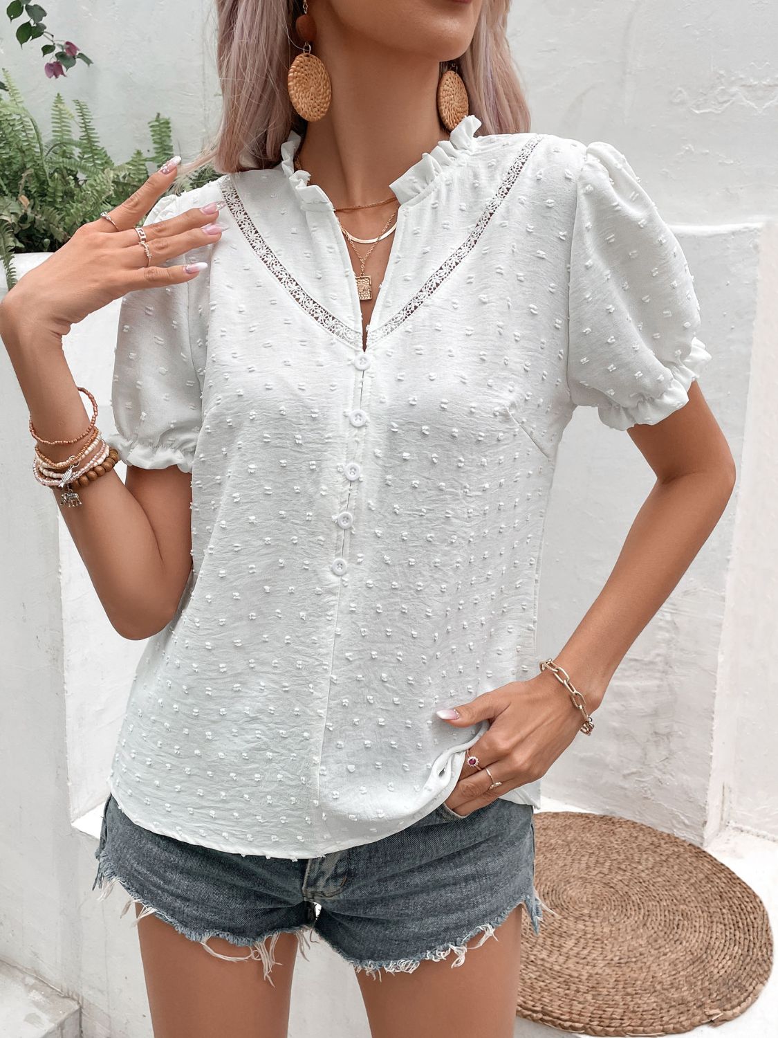 White Swiss dot blouse with button placket and puff sleeves, front view