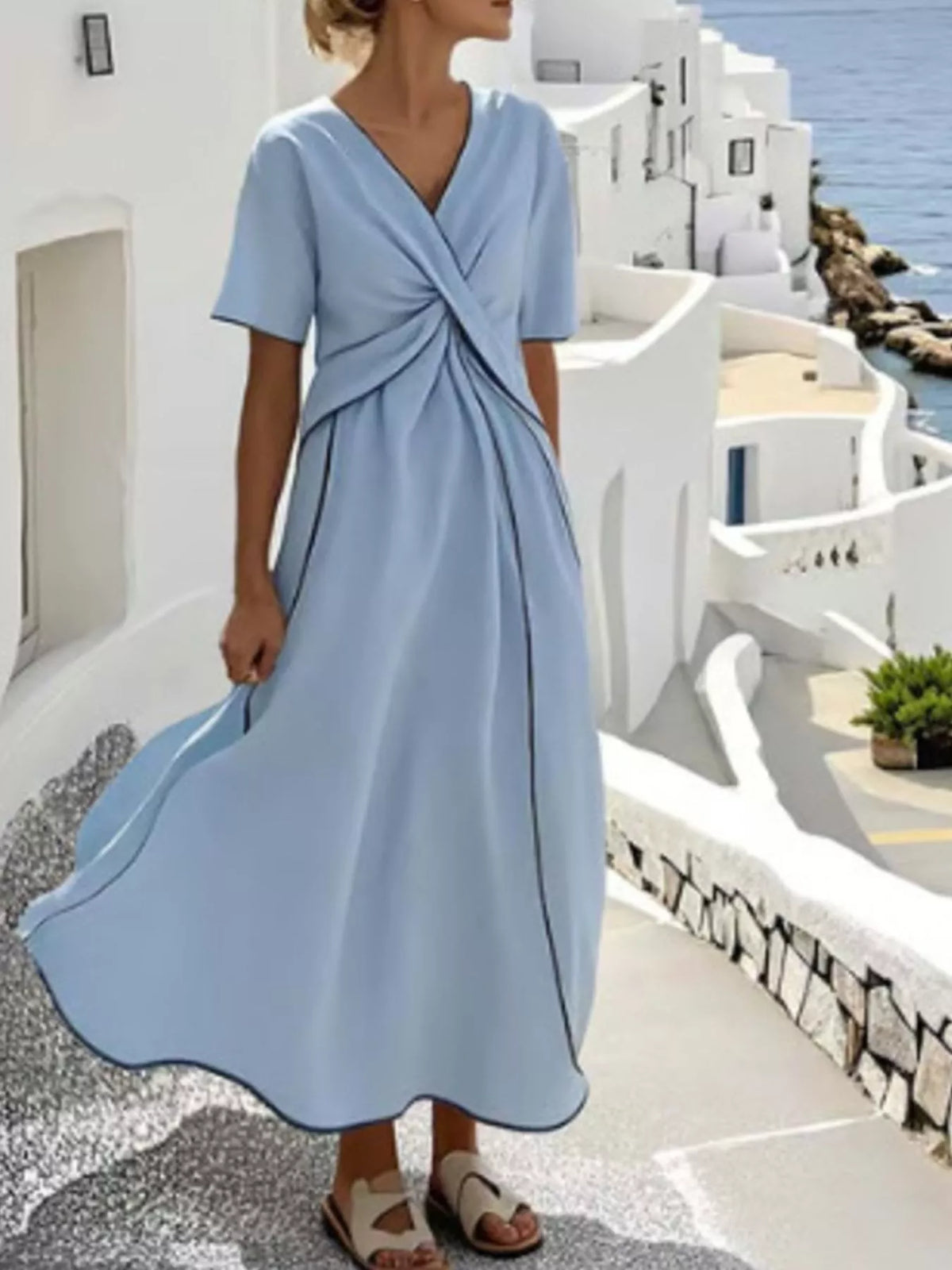 Light blue surplice midi dress with twist wrap front, short sleeves, gathered full skirt