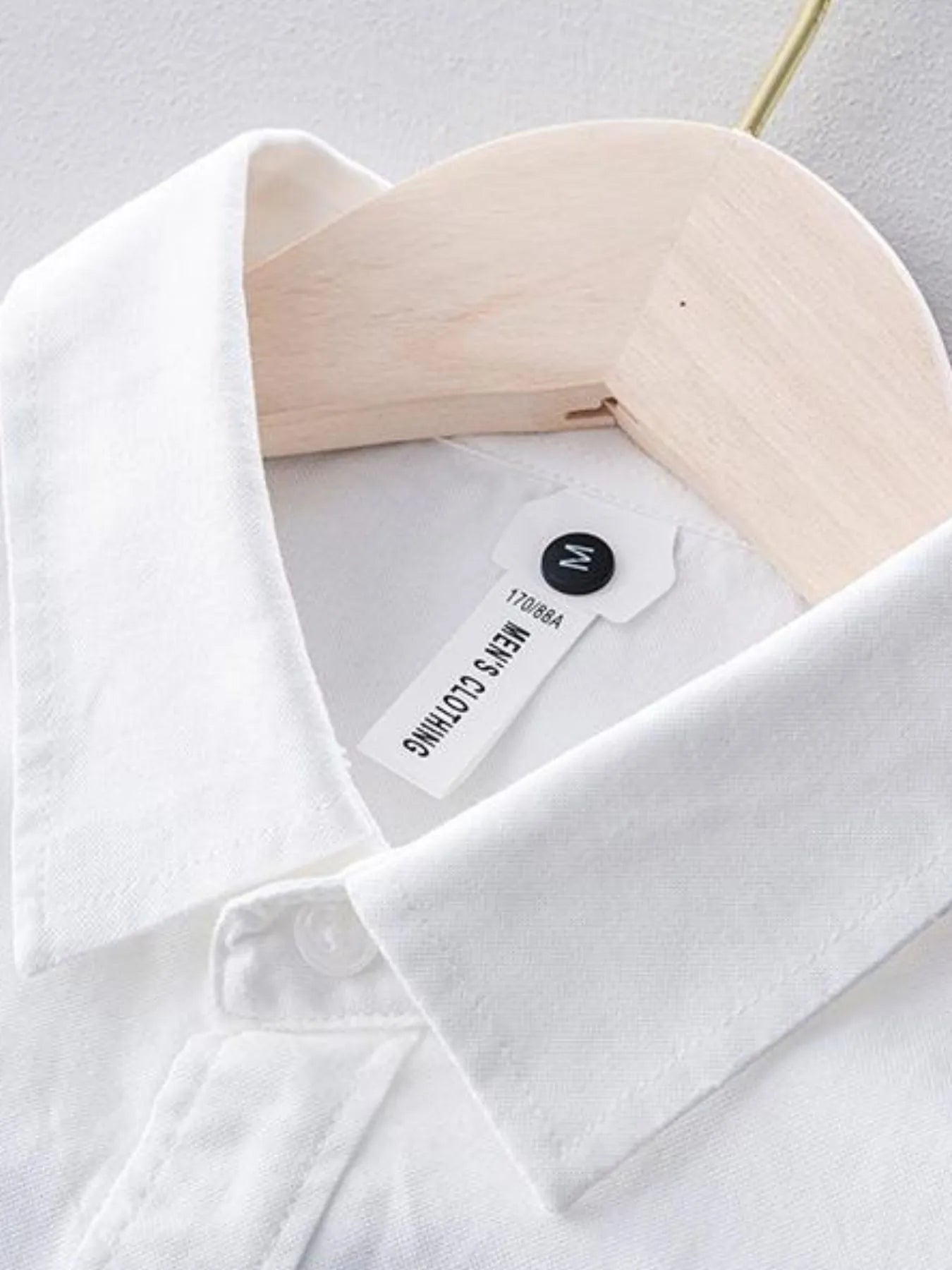 Plus size button-up long sleeve shirt cuff and collar detail, white with hanging tag