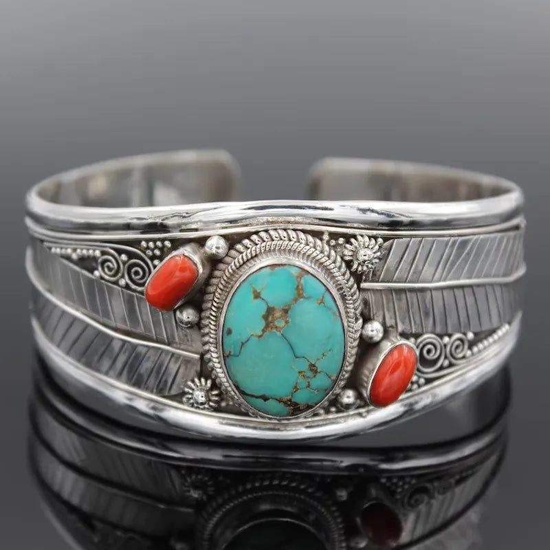 Engraved open cuff bracelet with oval turquoise stone and red coral side stones