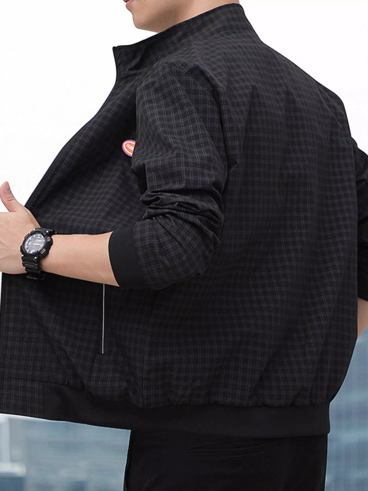 Men's plaid zip-up lightweight jacket, dark check, side view with hood and elastic hem.