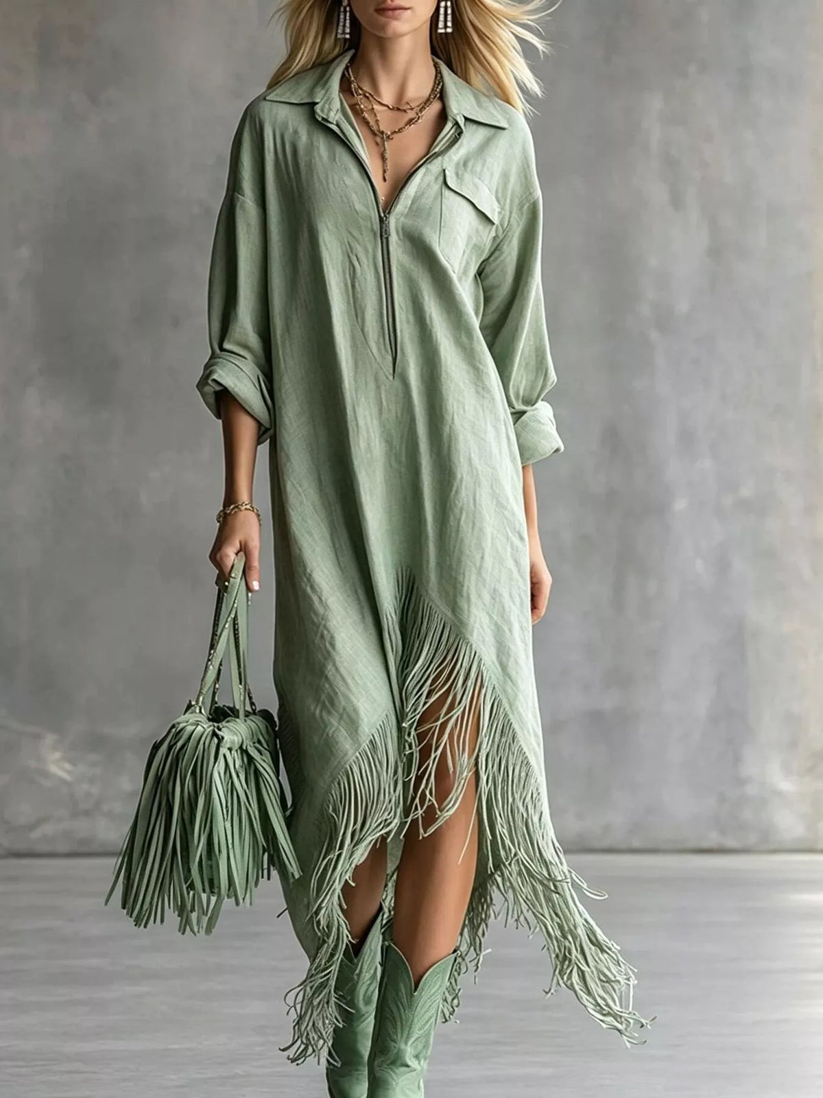 Light green zip-front shirt dress with fringe hem and three-quarter roll sleeves