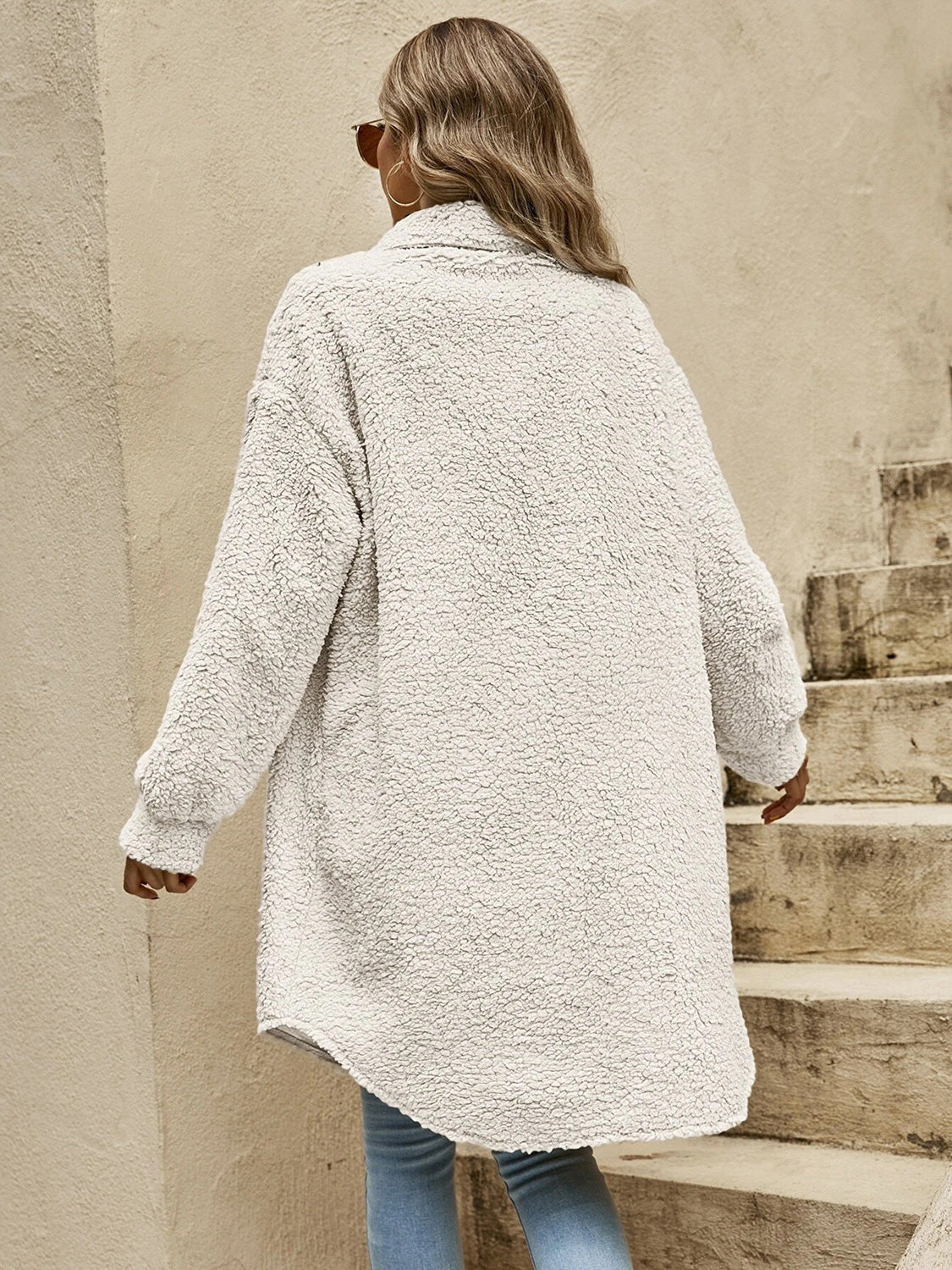 Light tan collared button-down sherpa coat, back view with long sleeves