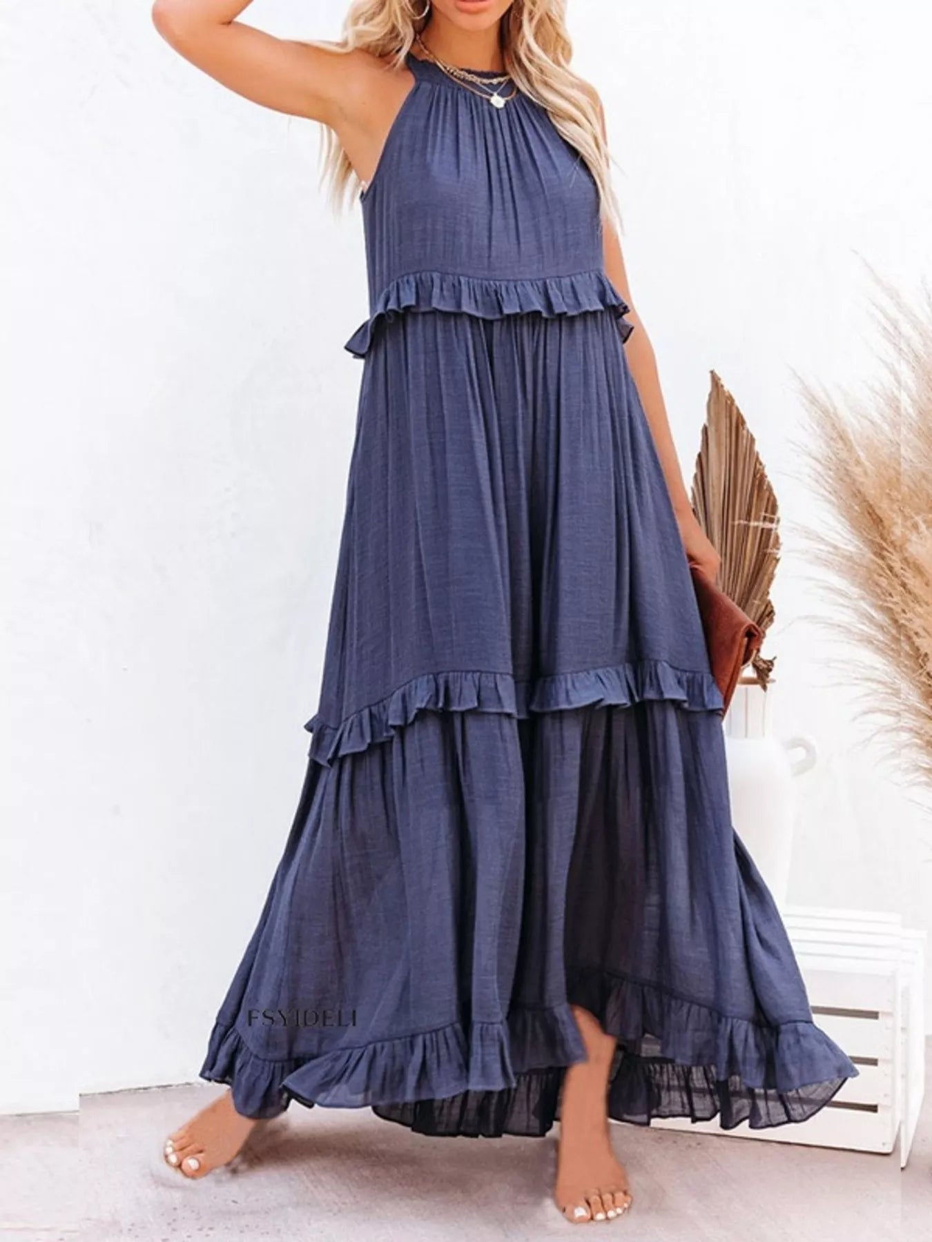 Navy ruffled tiered sleeveless maxi dress with tiered ruffles and gathered bodice
