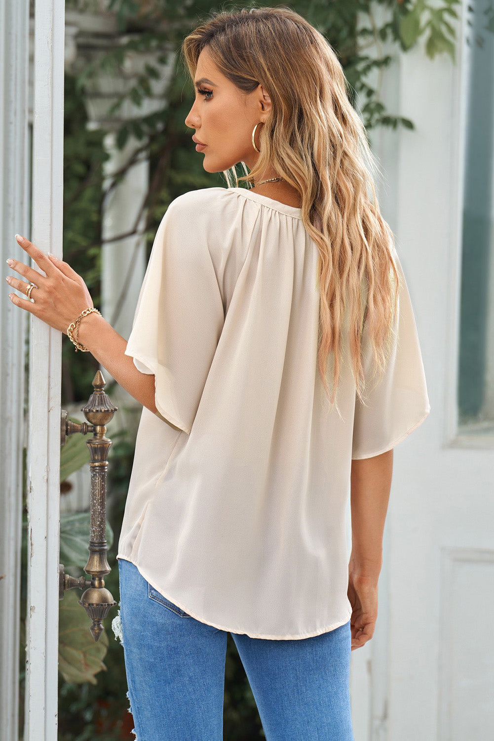 Back flutter sleeve top with gathered neckline yoke, cream fabric