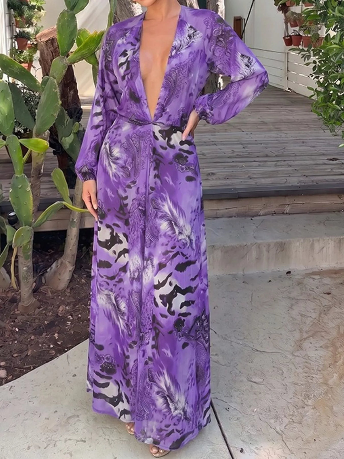 Purple printed long-sleeve maxi dress with deep V front and flowing skirt