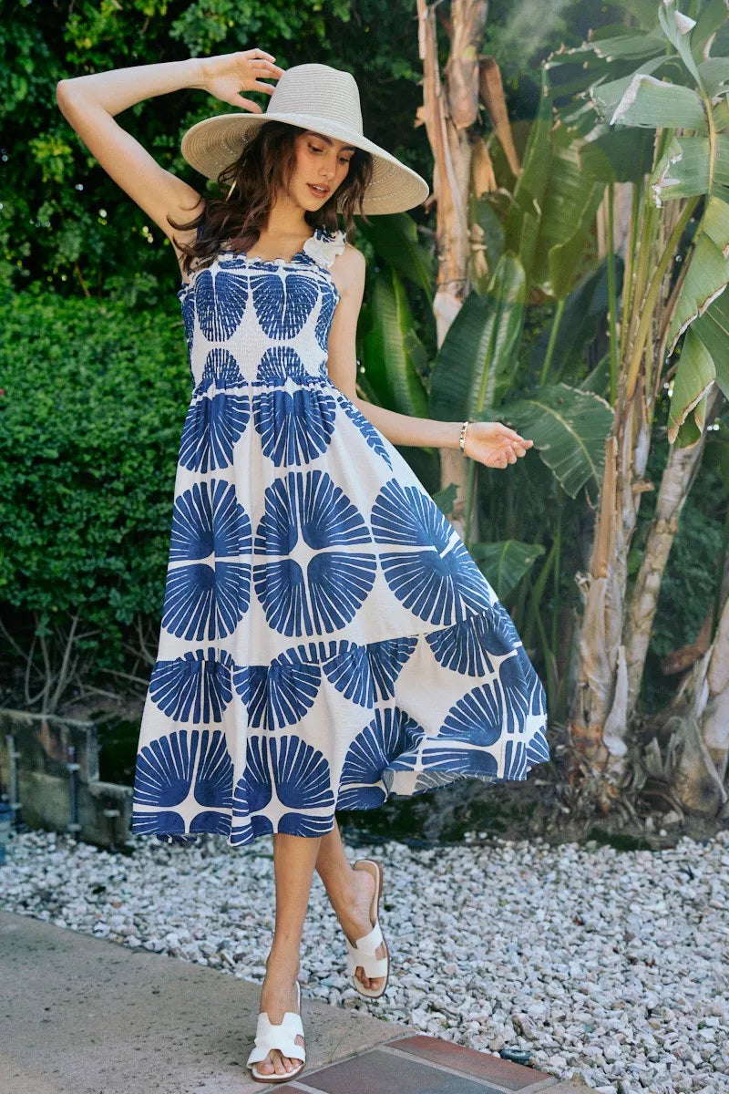 Smocked bodice tiered midi dress with navy abstract circles and shapes on white, sleeveless