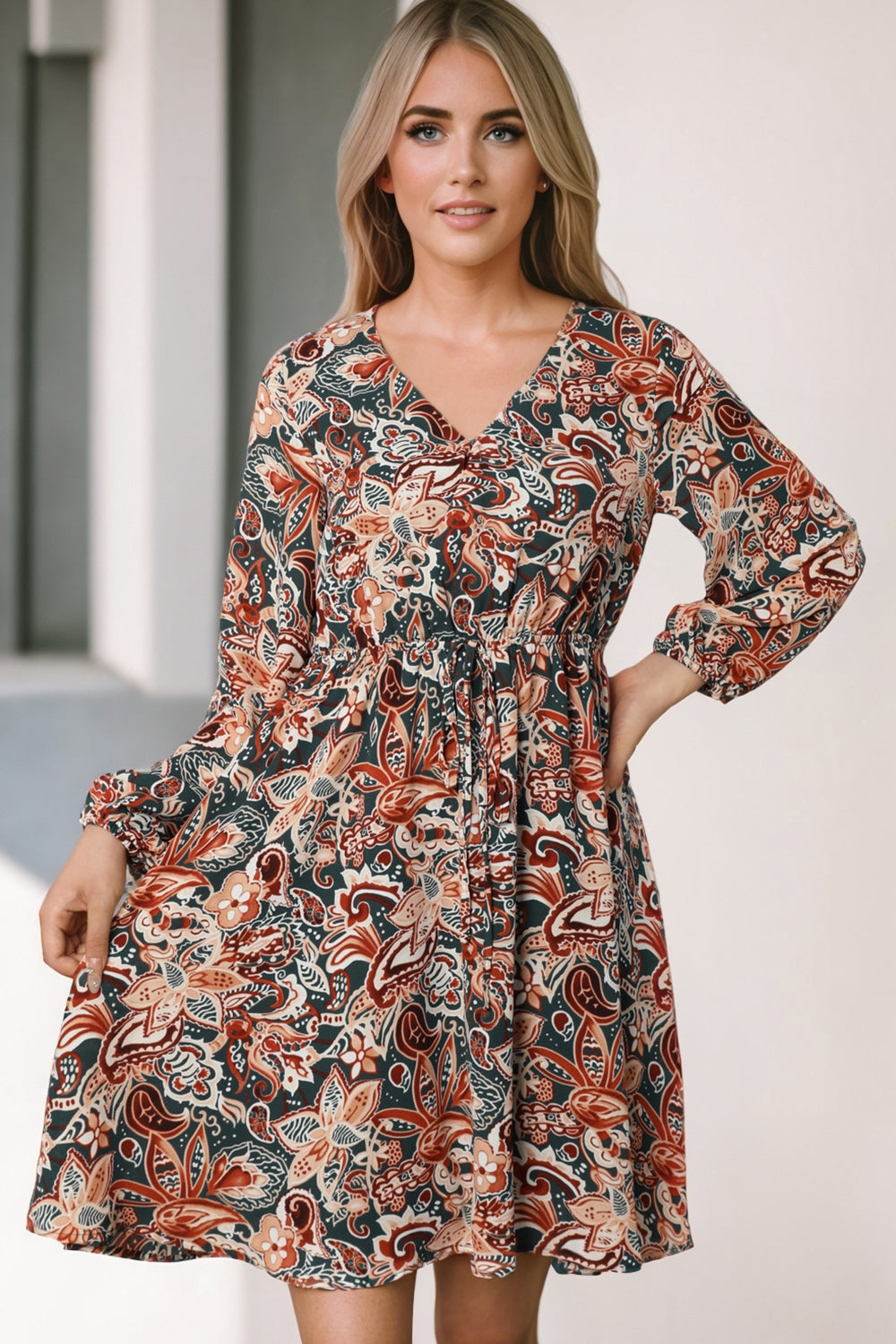 Printed V-neck mini dress with long sleeves, paisley multicolor print and gathered waist