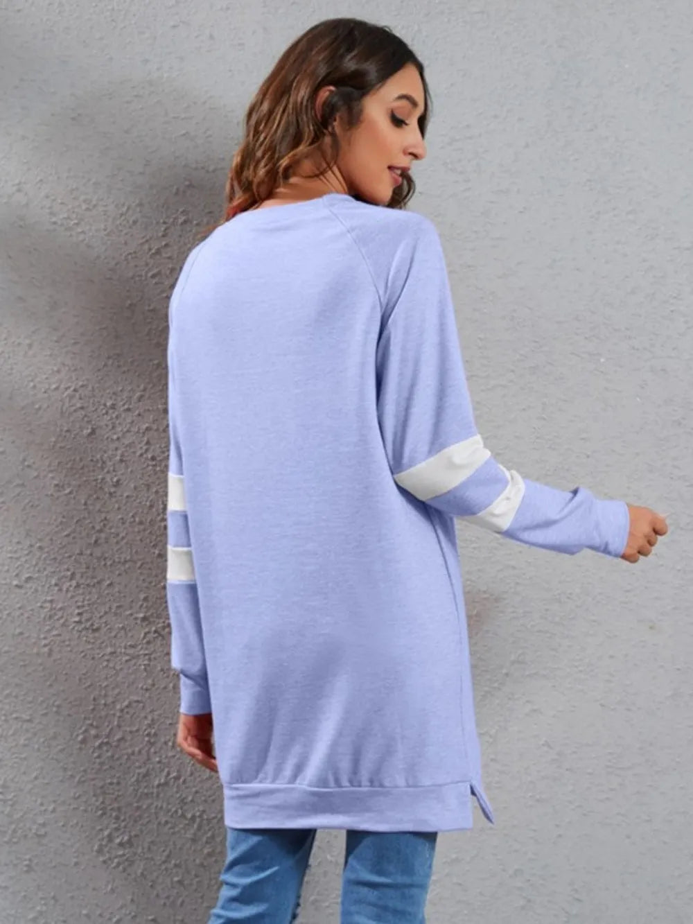 Light blue striped long-sleeve round-neck T-shirt with white side sleeve stripes