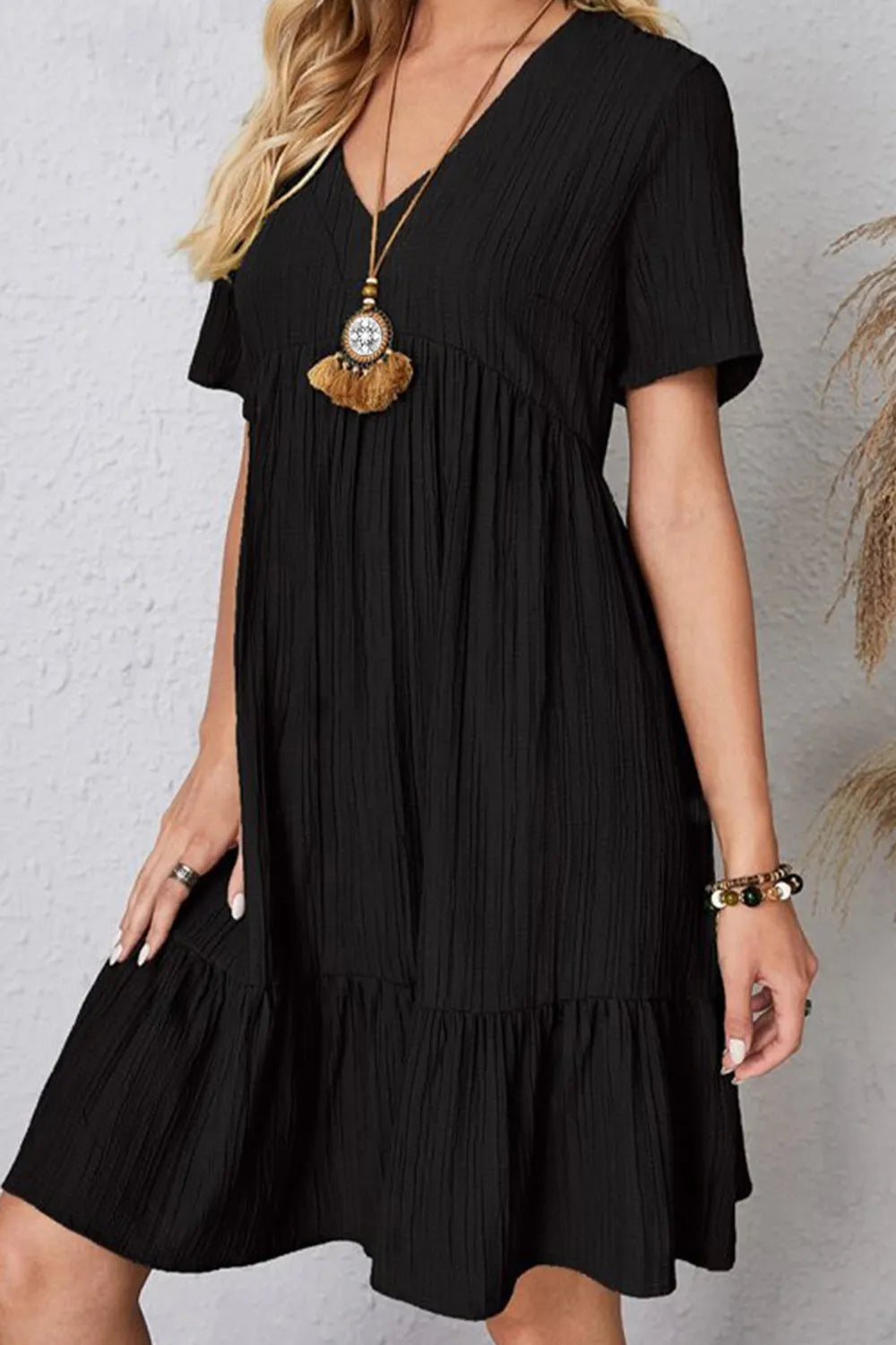 Black ruched V-neck short-sleeve tiered dress with gathered waist