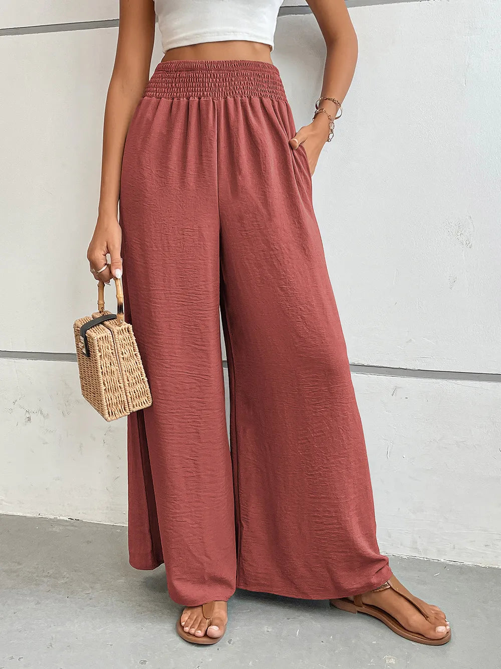 Wide-leg pants in dusty rose pink with elastic waistband and relaxed wide-leg cut