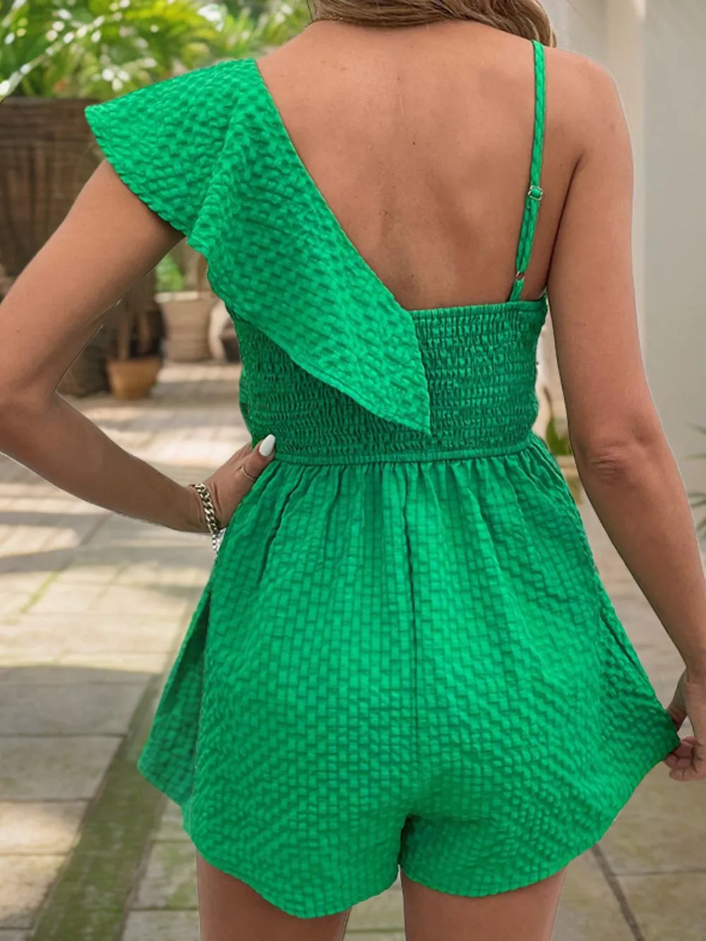 Green backless asymmetrical ruffled romper with open back and smocked waist