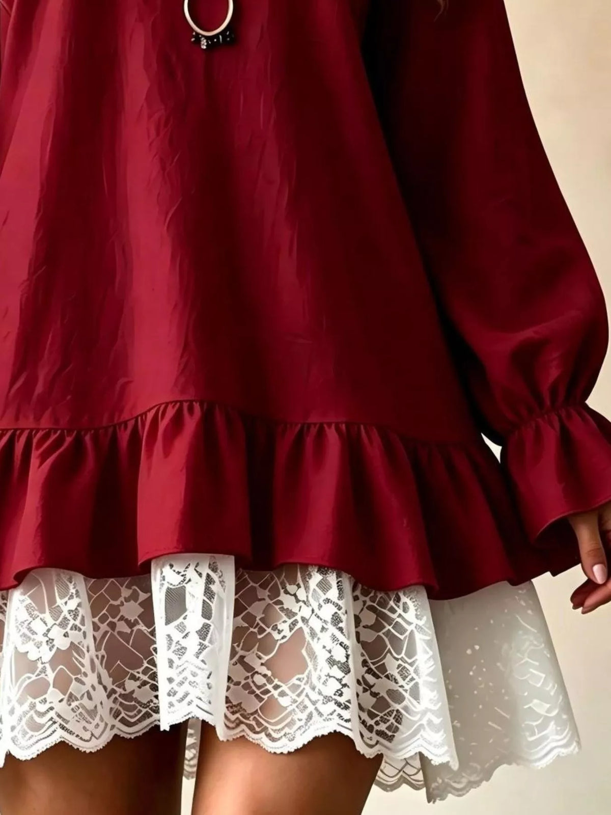 Burgundy long-sleeve mini dress with lace ruffle hem and gathered puff cuffs