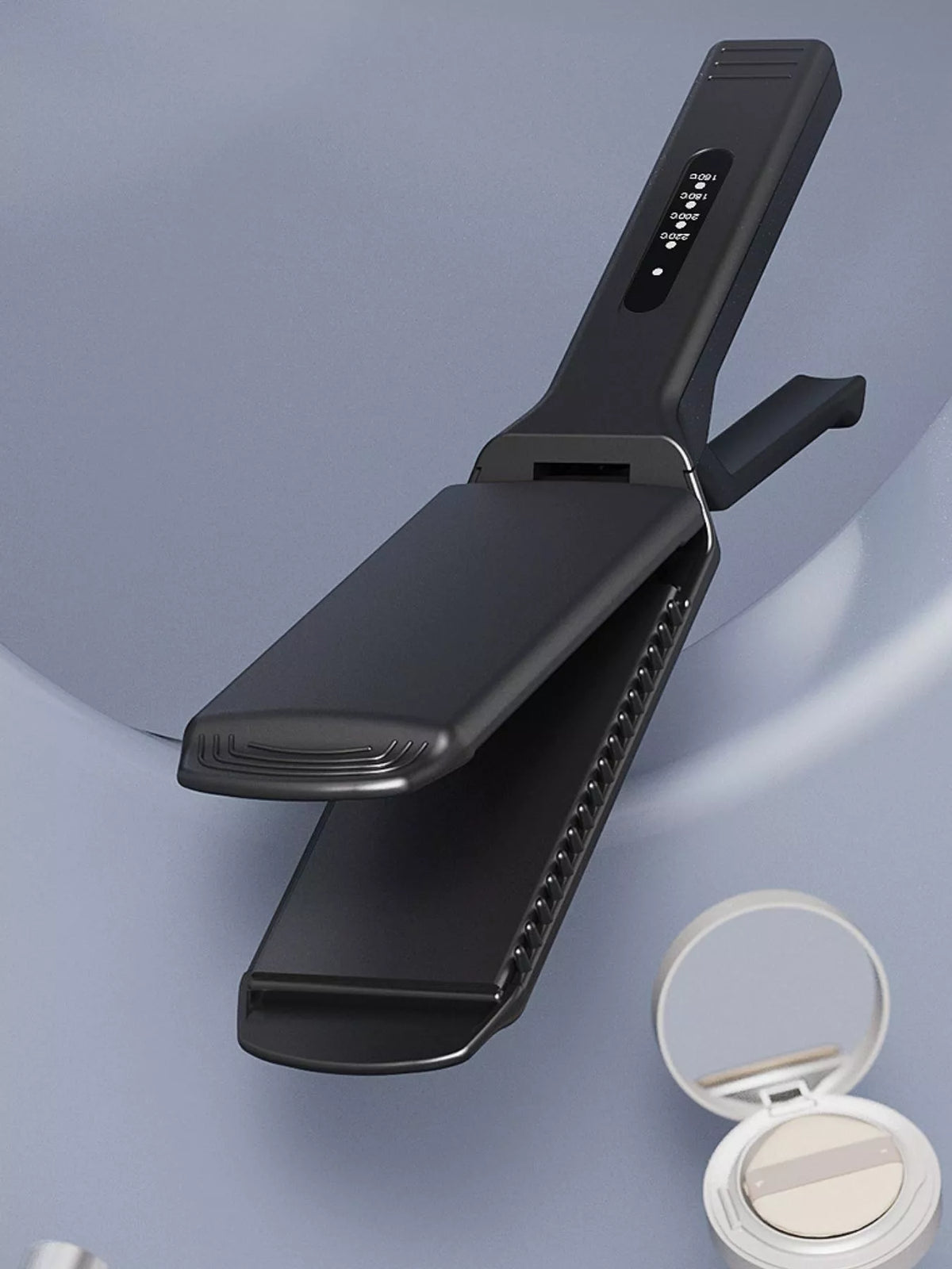 Black portable heat hair straightener with angled plates and indicator buttons