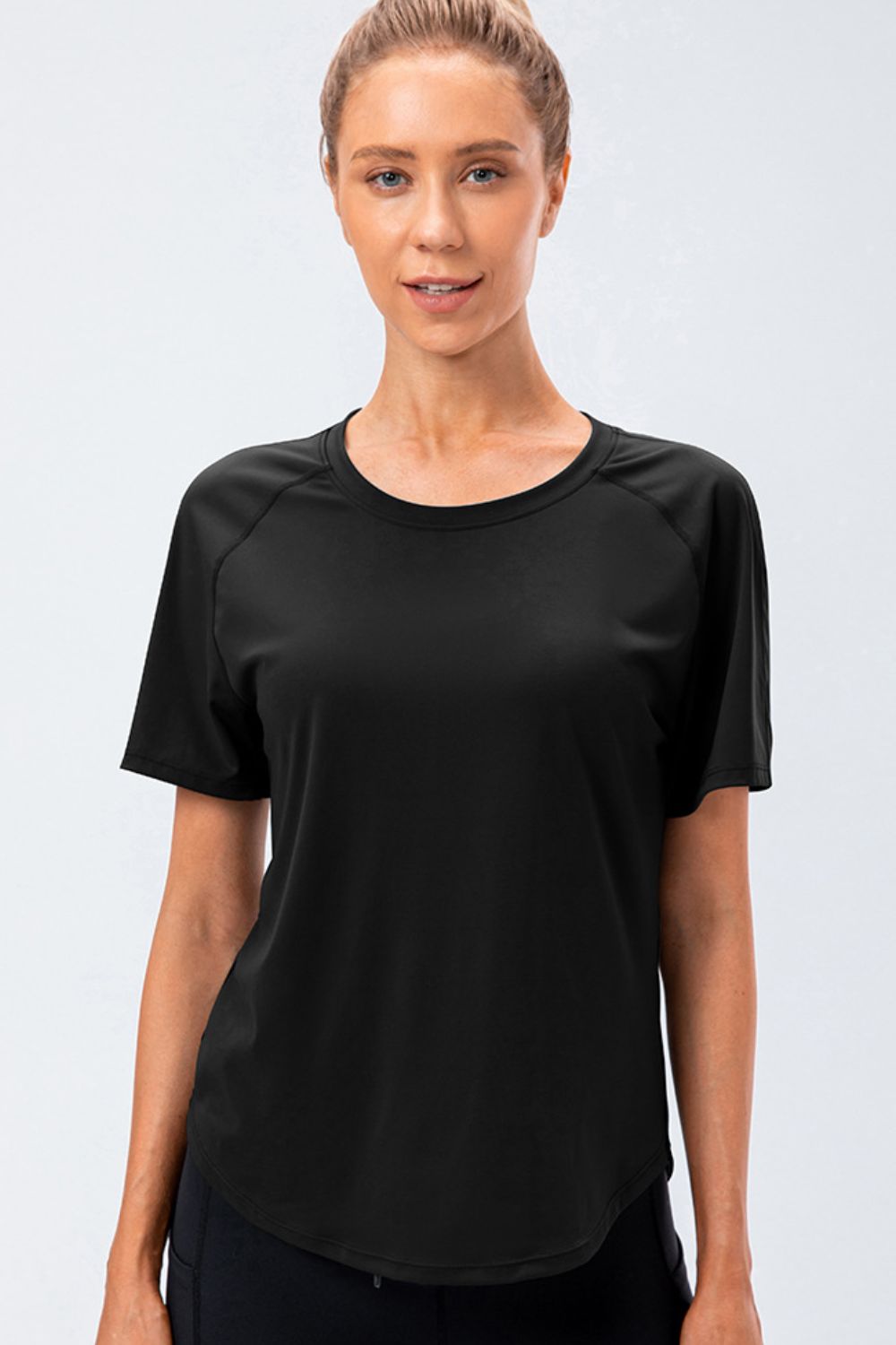 Black active tee with round neck and raglan sleeves, front view