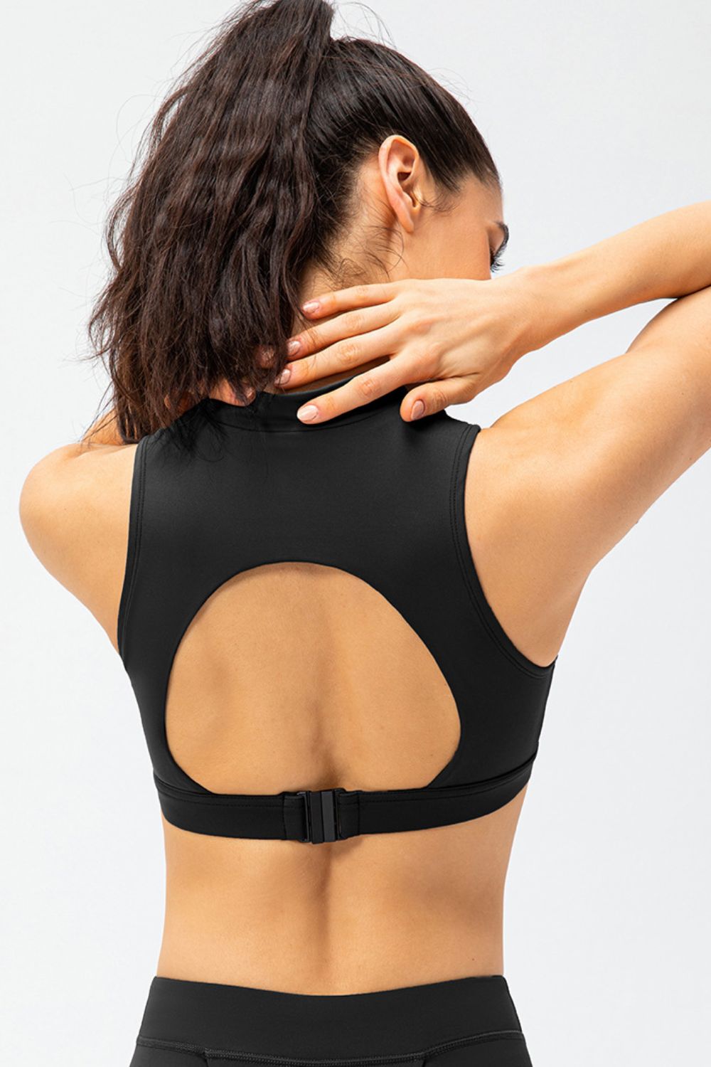 Black active tank top with cutout back and front half-zip, sleeveless cropped fit