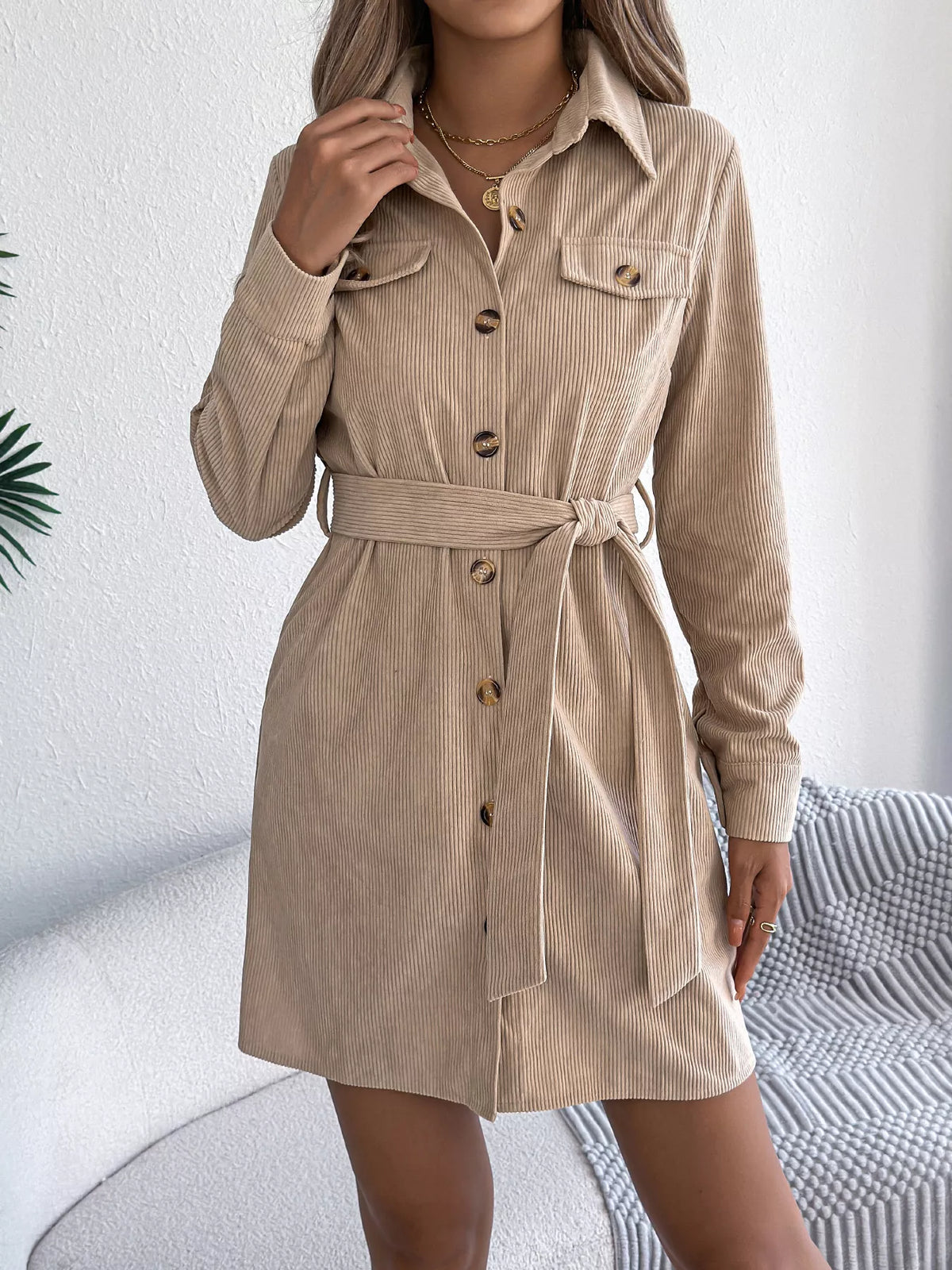 Khaki corduroy shirt dress with collar, button front, and tied waist belt