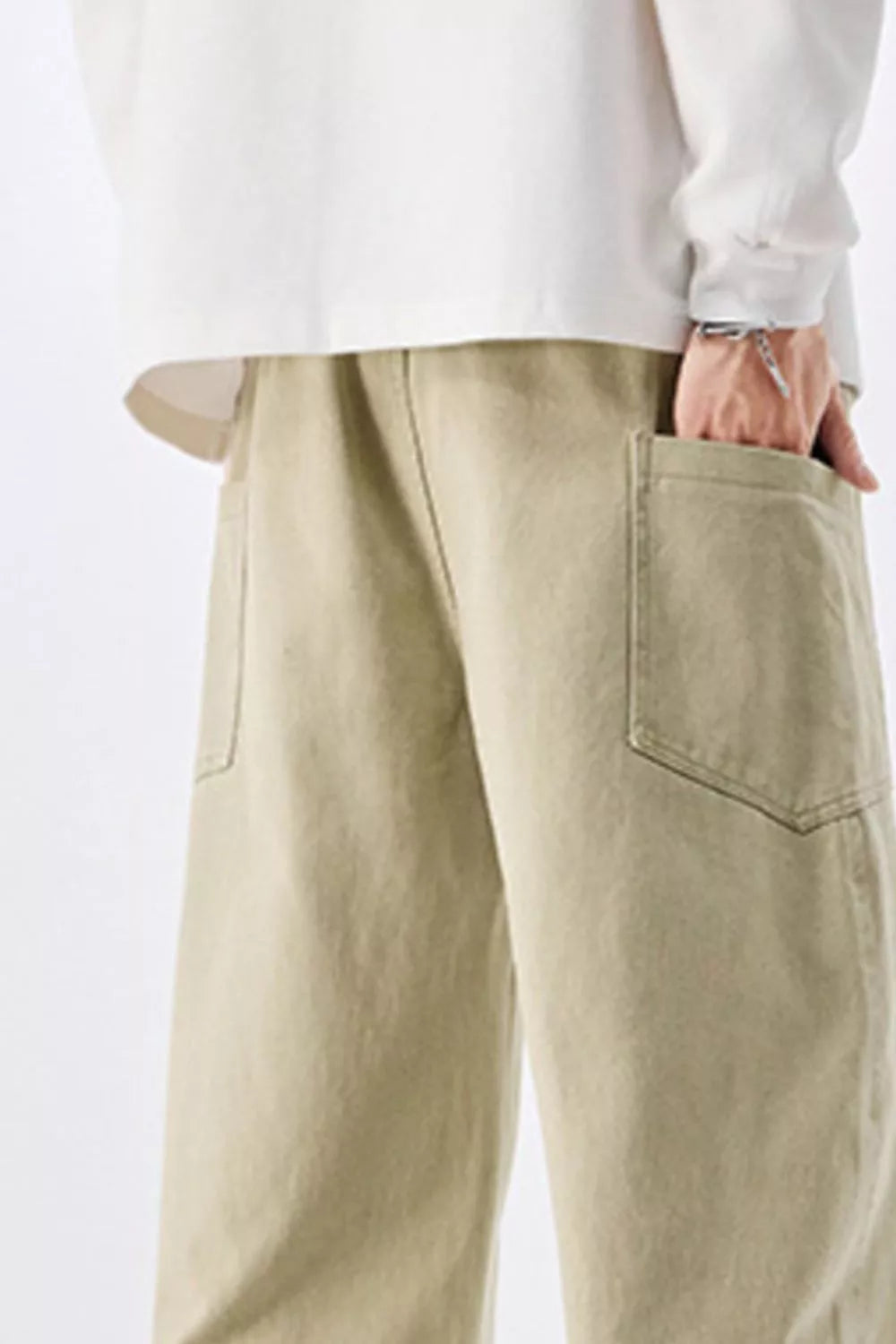 Men's sage cotton drawstring jeans with roomy front patch pocket