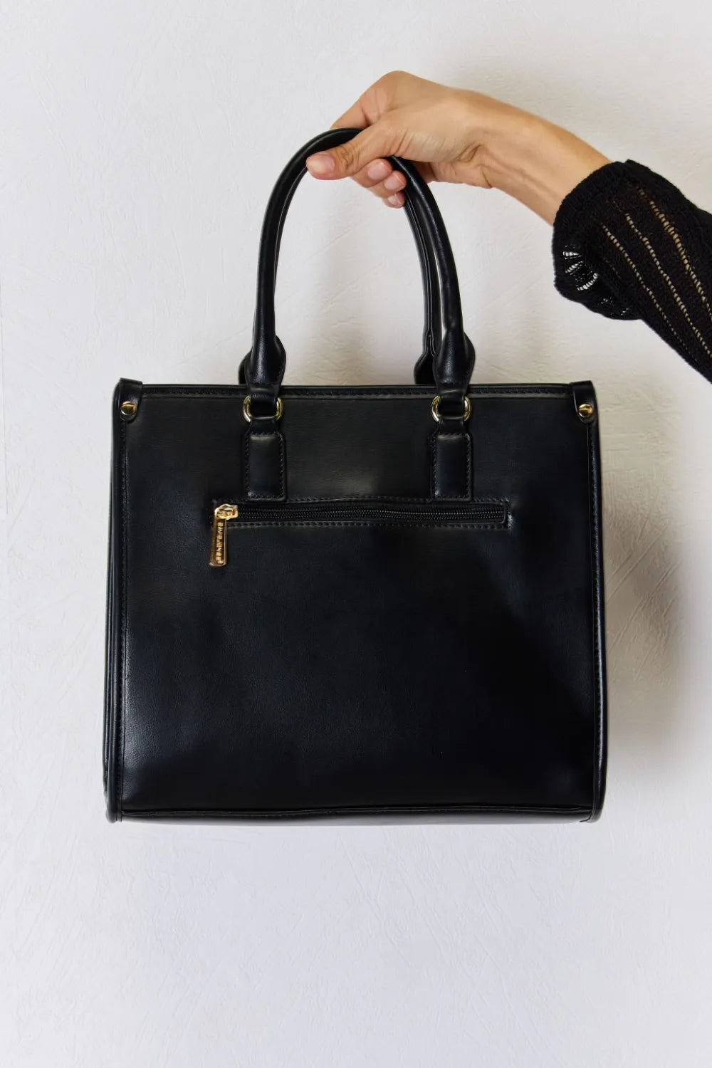 Black PU leather handbag with two top handles and gold-tone vertical logo detail