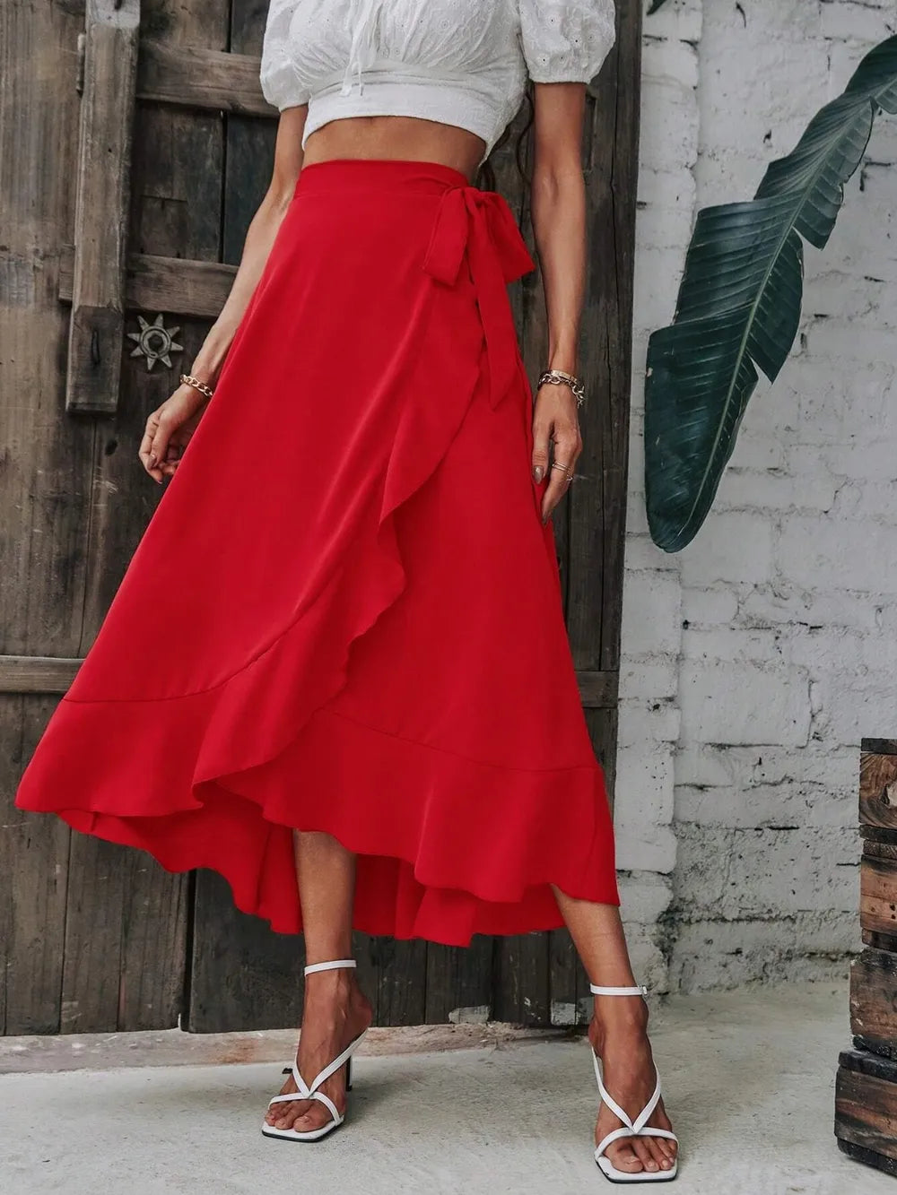 Tied ruffled midi skirt in bright red, bow-tied waist and tiered ruffle hem