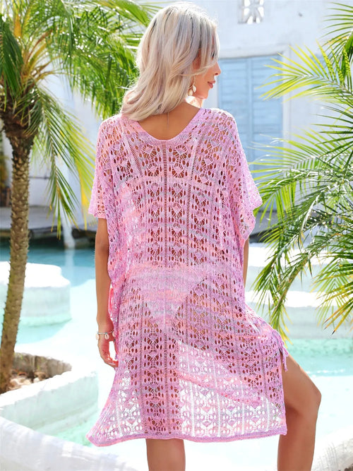 Pink openwork knit V-neck cover-up shown from back with short sleeves