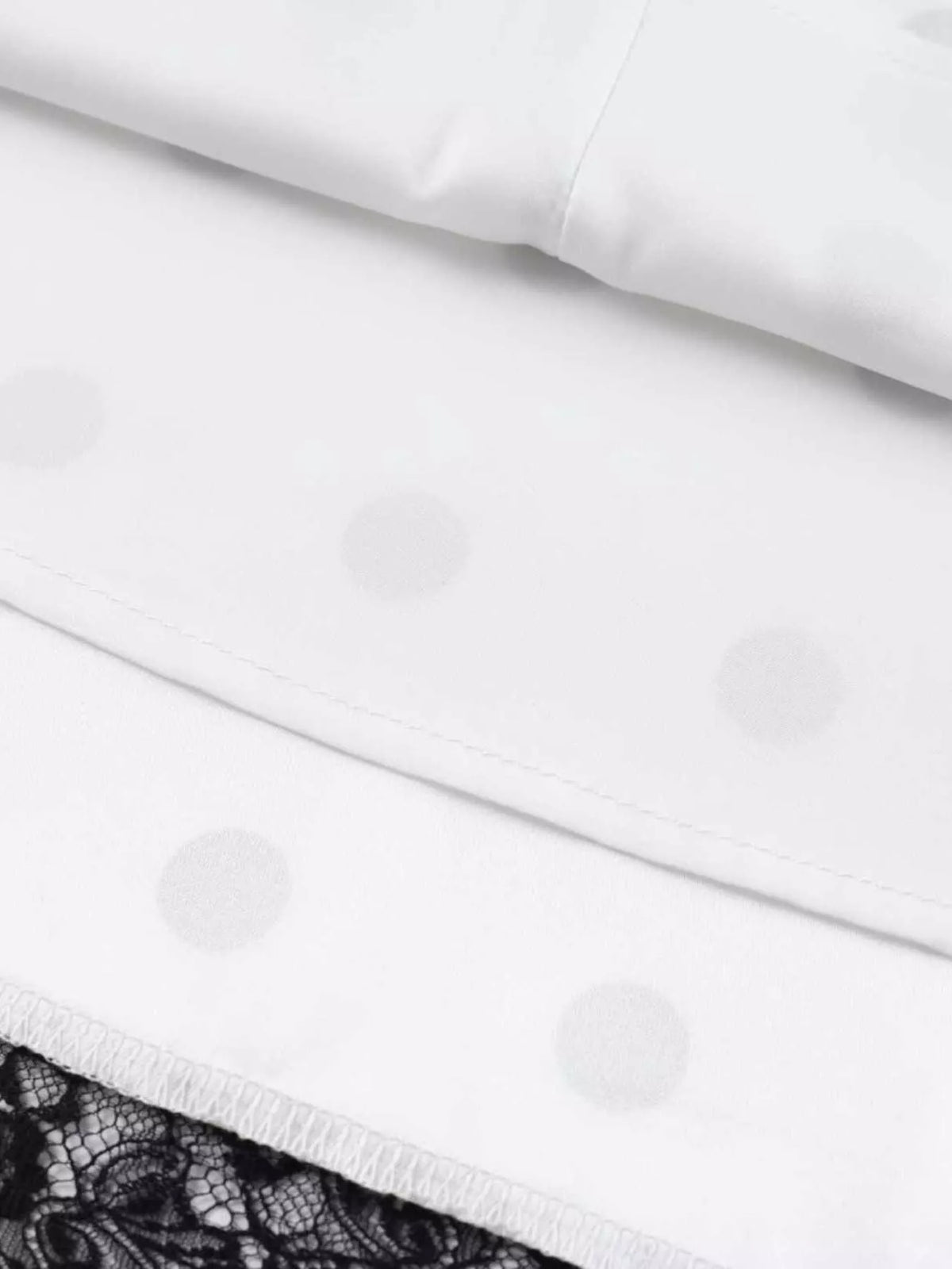 White skirt waistband with light polka dot texture and lace lining